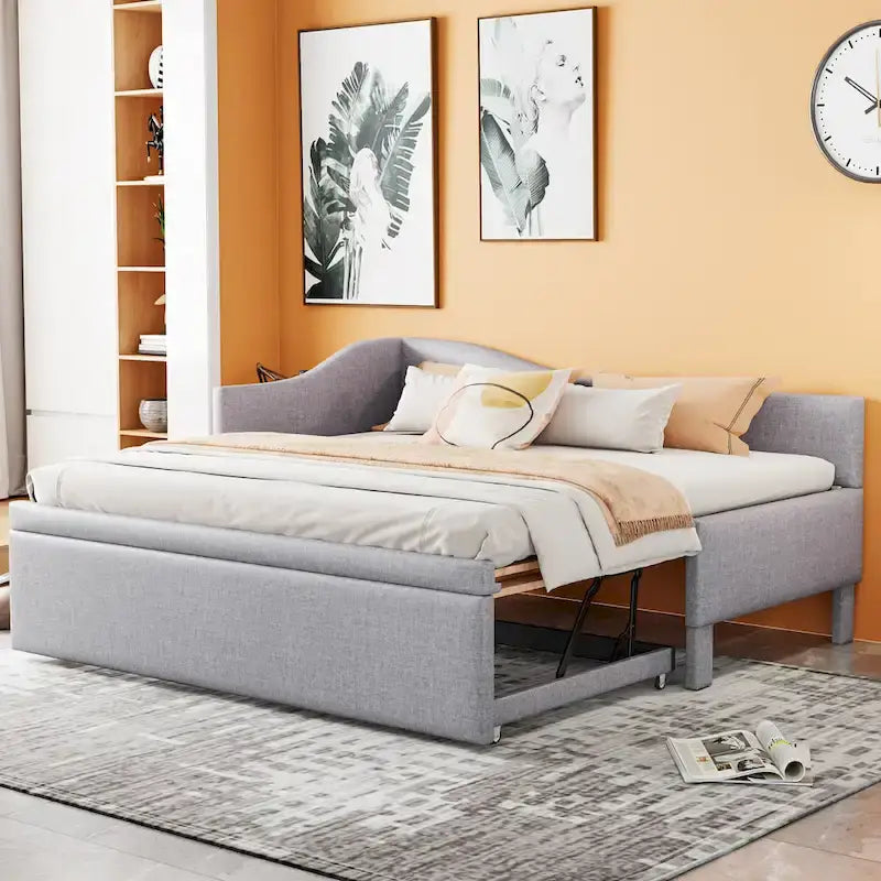 Divano letto imbottito a L rosa con letto estraibile a scomparsa, due posti letto