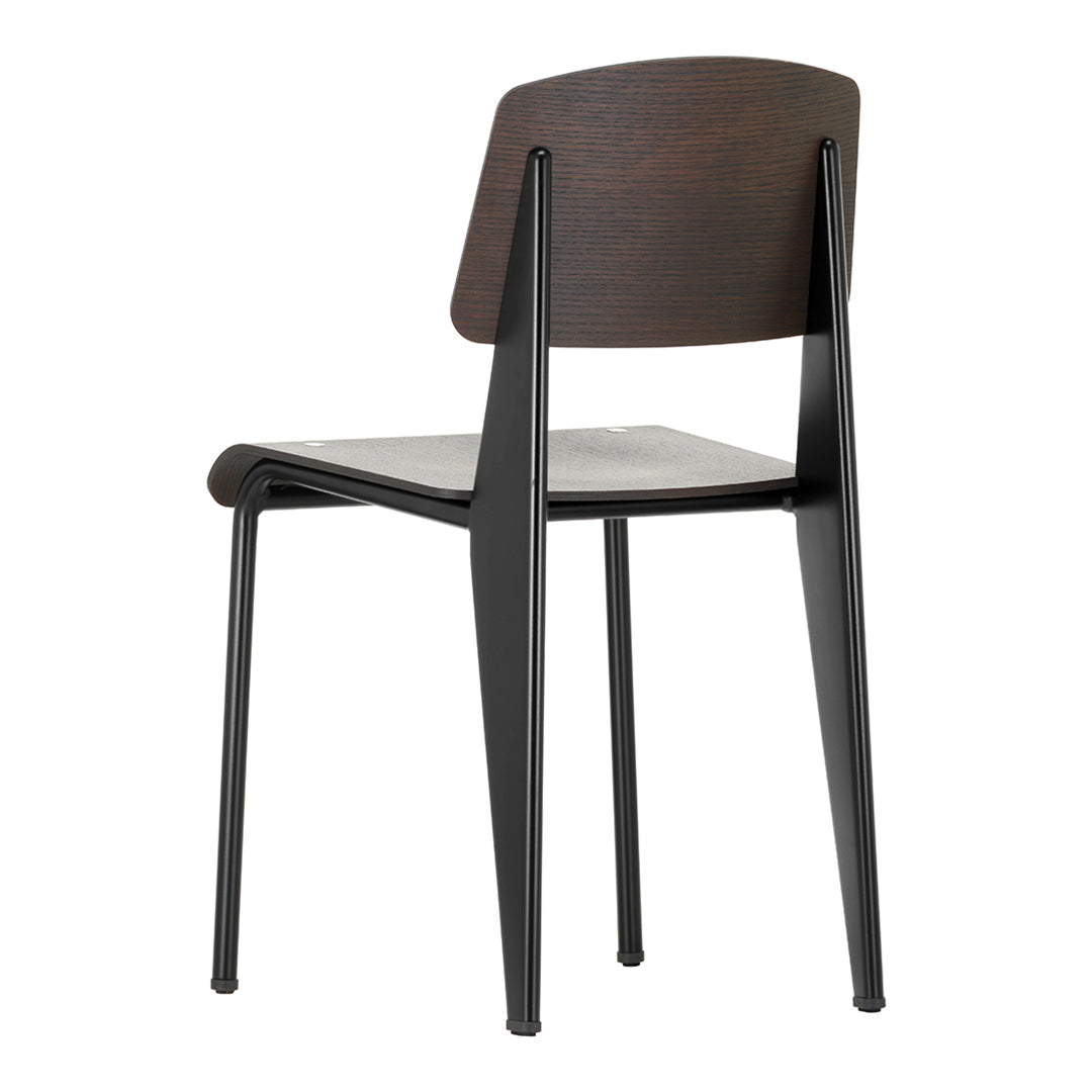 Sedia standard con tubo d'acciaio estetico ingegneristico e legno massello con design strutturale di Jean Prouvé per sala da pranzo