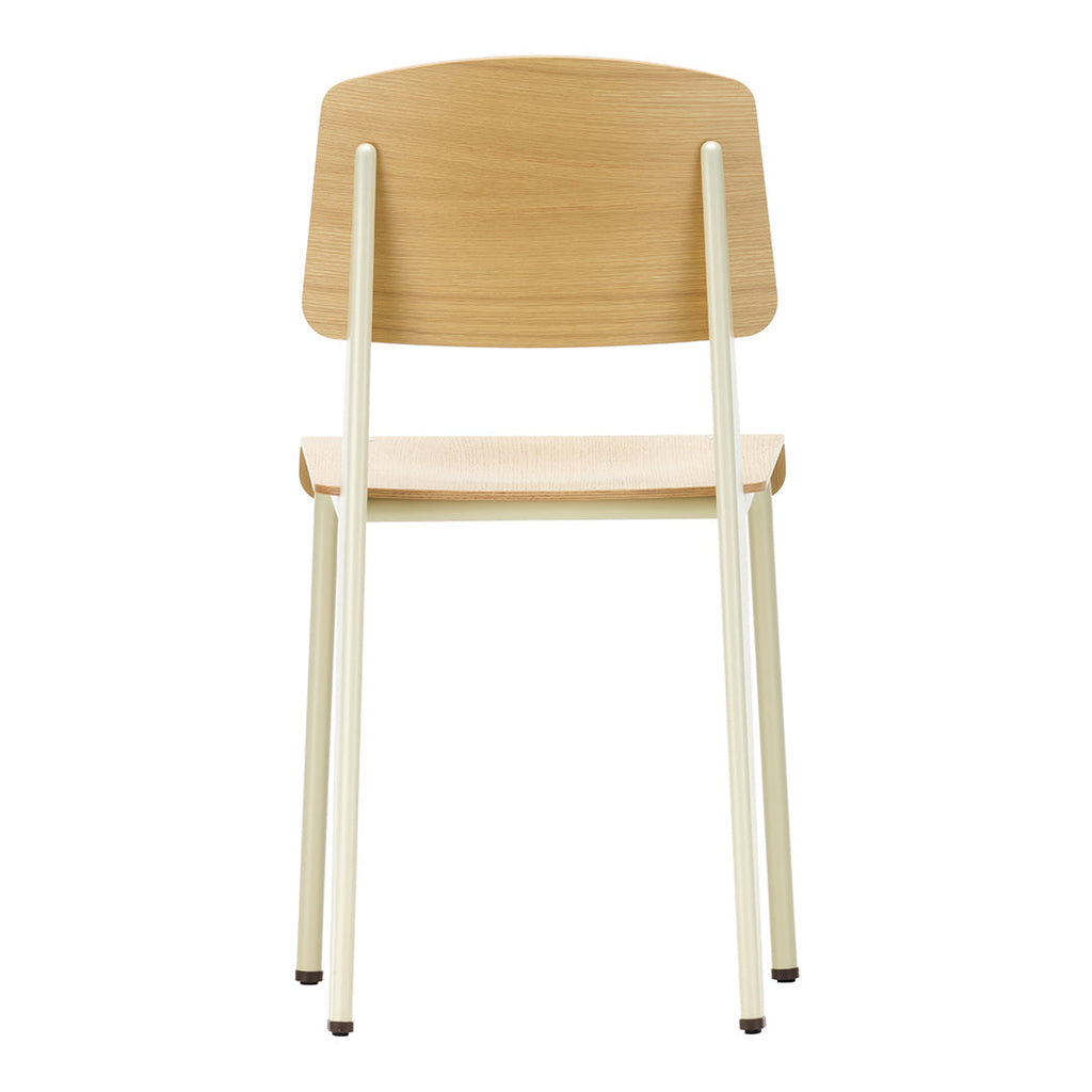 Sedia standard con tubo d'acciaio estetico ingegneristico e legno massello con design strutturale di Jean Prouvé per sala da pranzo