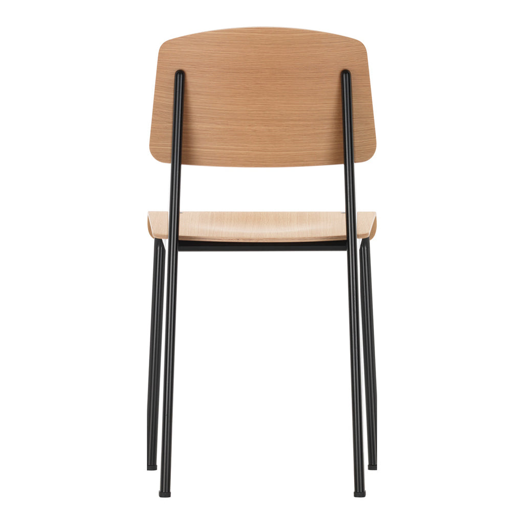 Sedia standard con tubo d'acciaio estetico ingegneristico e legno massello con design strutturale di Jean Prouvé per sala da pranzo