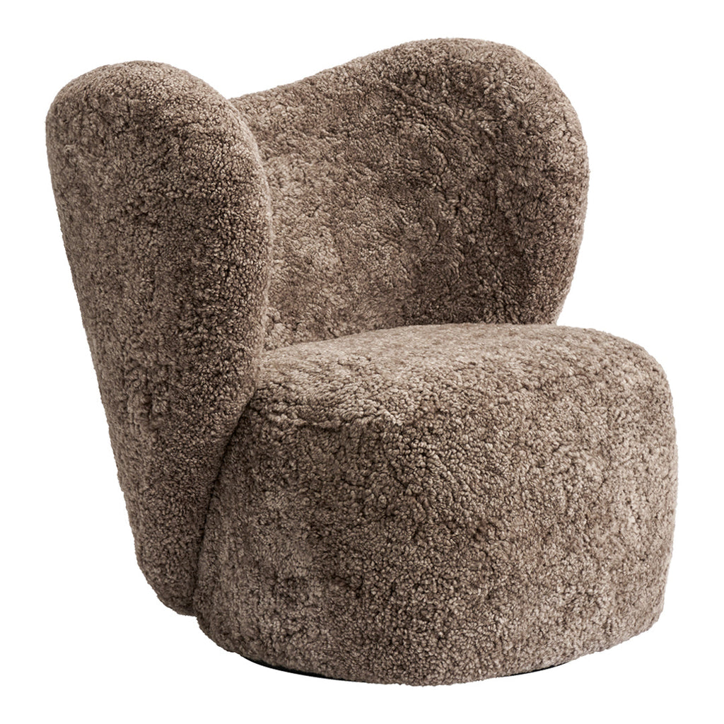 Poltrona lounge girevole imbottita scultorea organica con base girevole a scomparsa per soggiorno