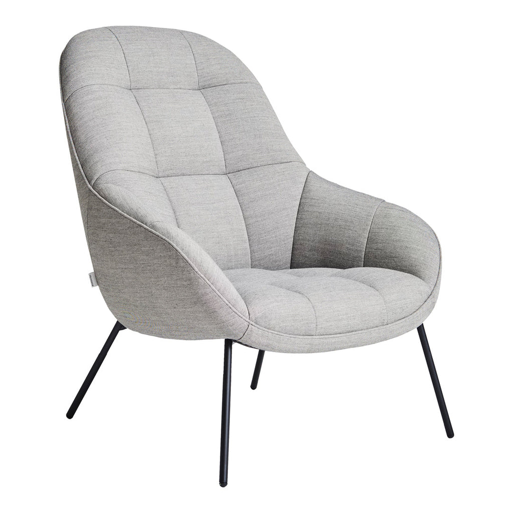 Poltrona lounge moderna e rivestita in tessuto organico con interno ispirato a spicchi di mango, ideale per il soggiorno
